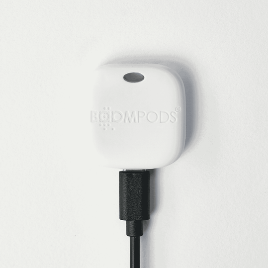 White device with 'boompods' branding on a light gray background